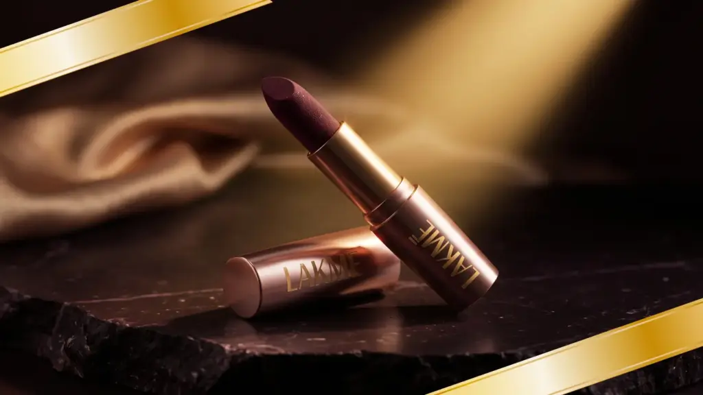 Lakme 9to5 Primer Matte lipstick in rose gold packaging on dark stone surface under warm editorial lighting — matte lipstick review India
