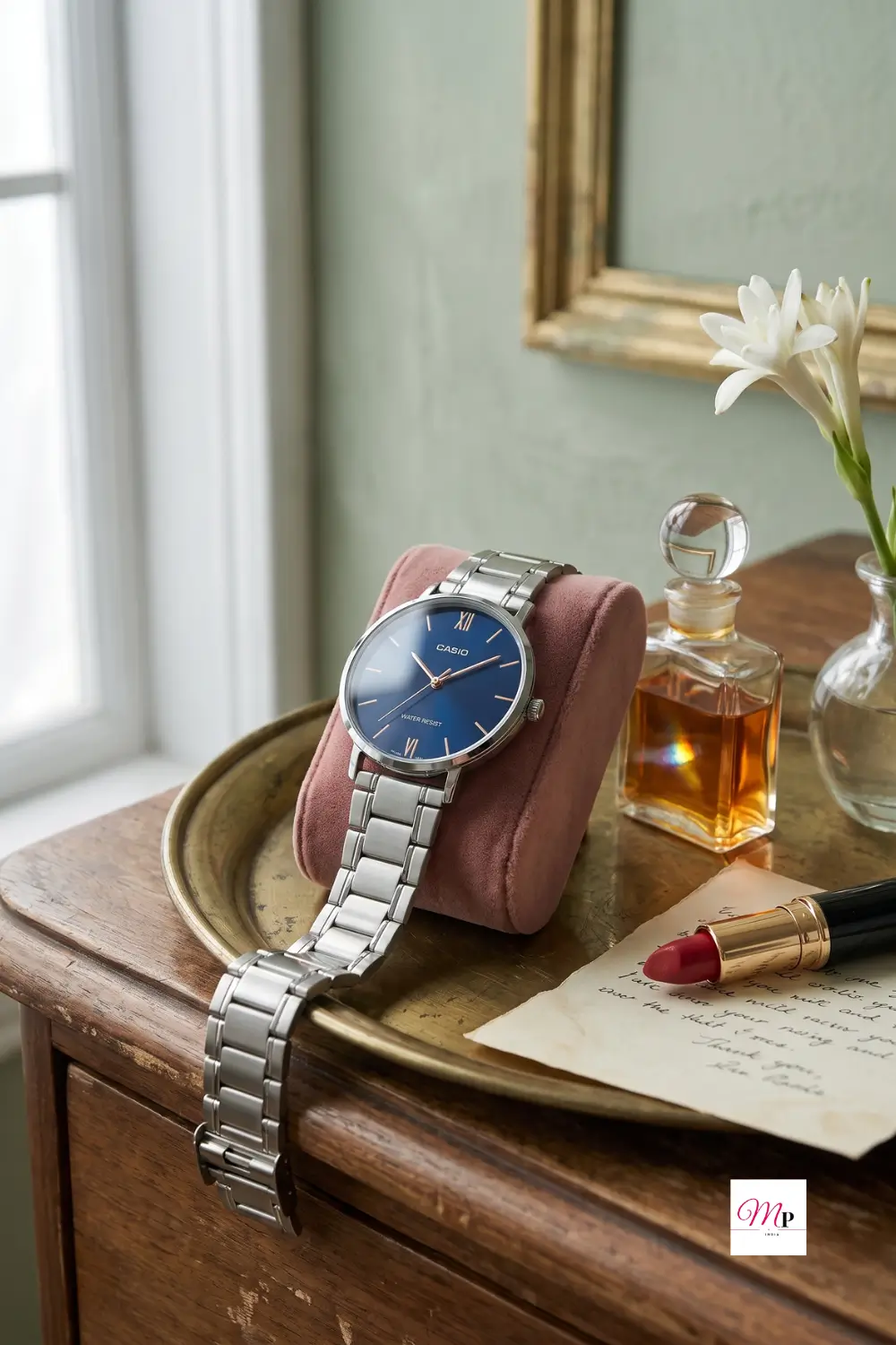 Casio Enticer elegant dress watch styled on vintage vanity with perfume, shaadi ke liye perfect accessory