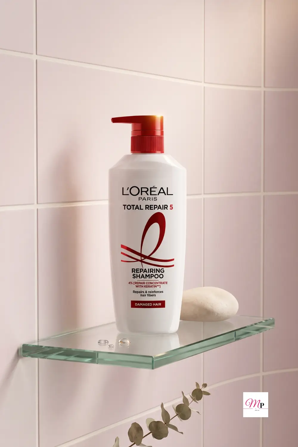 L'Oreal Total Repair 5 shampoo on glass vanity shelf with cotton pads and green leaves, keratin hair repair routine