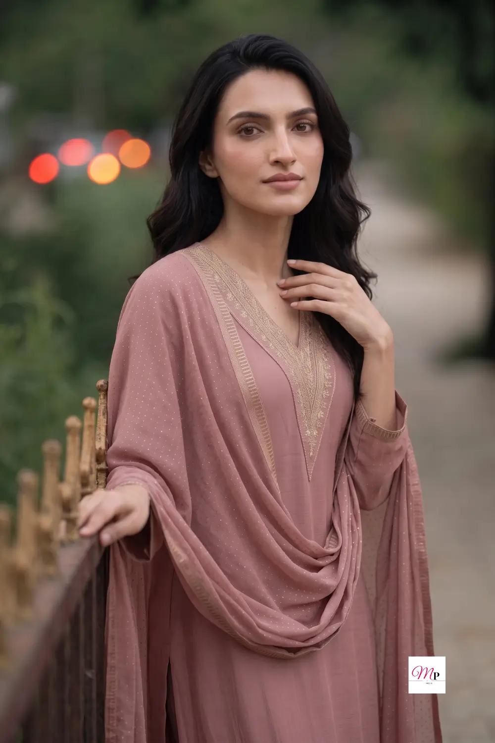 Portrait of model wearing dusty rose sequinned kurta set with dupatta draped elegantly, Gerua by Libas ethnic wear