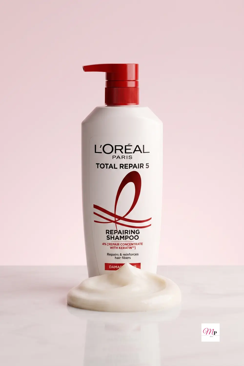 L'Oreal Paris Total Repair 5 repairing shampoo bottle with red cap on blush background, loreal total repair 5 keratin shampoo