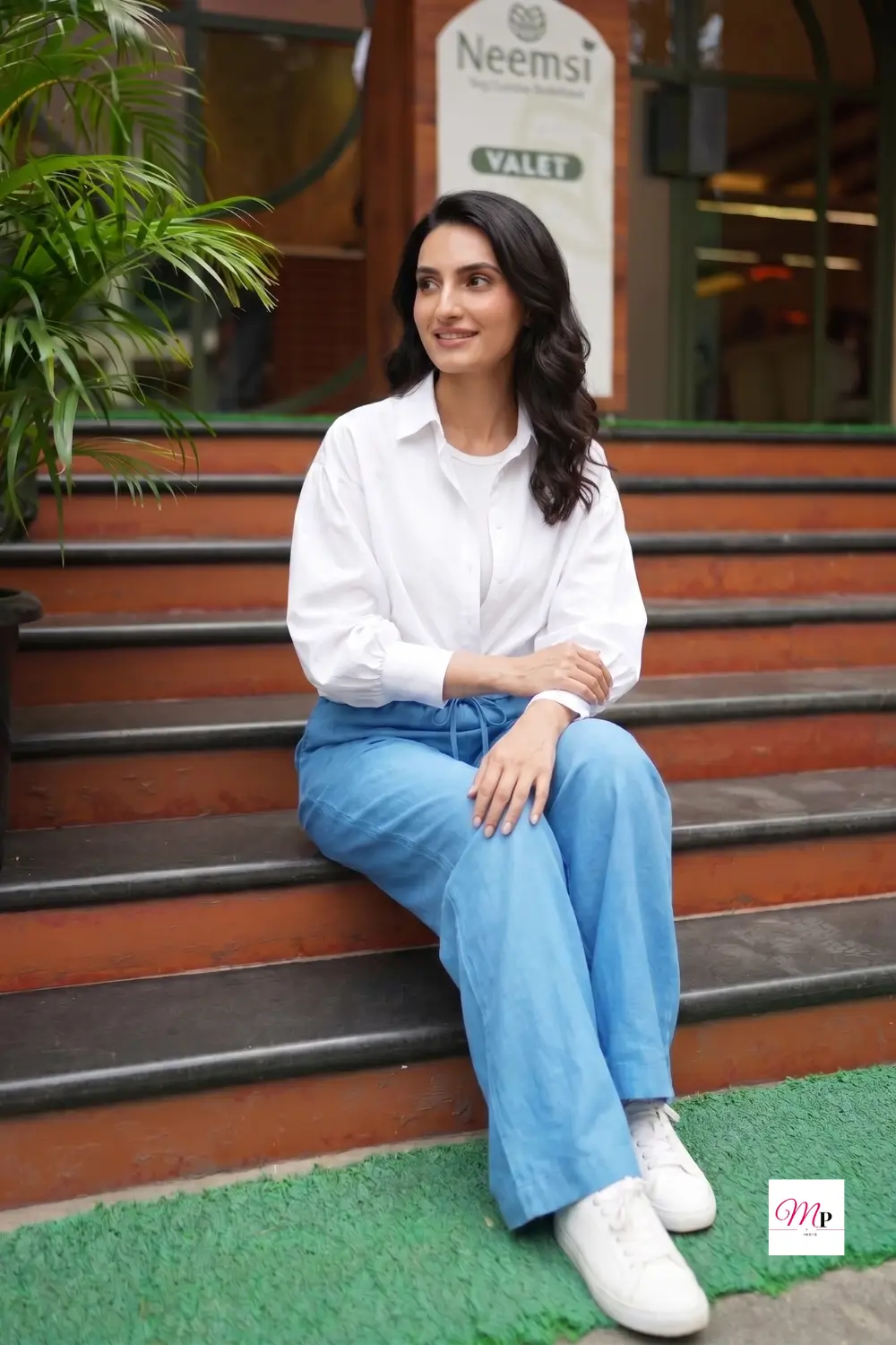 Close up seated view of linen blend trousers showing drawstring waistband and fabric texture — office jaane ke liye comfortable