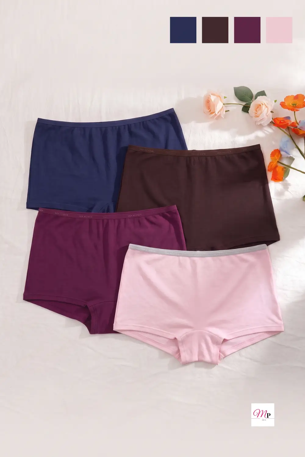 Four pairs of Van Heusen anti-bacterial moisture-wicking boyshorts in blush pink, navy, burgundy and brown on warm ivory linen with roses for humidity-proof underwear women