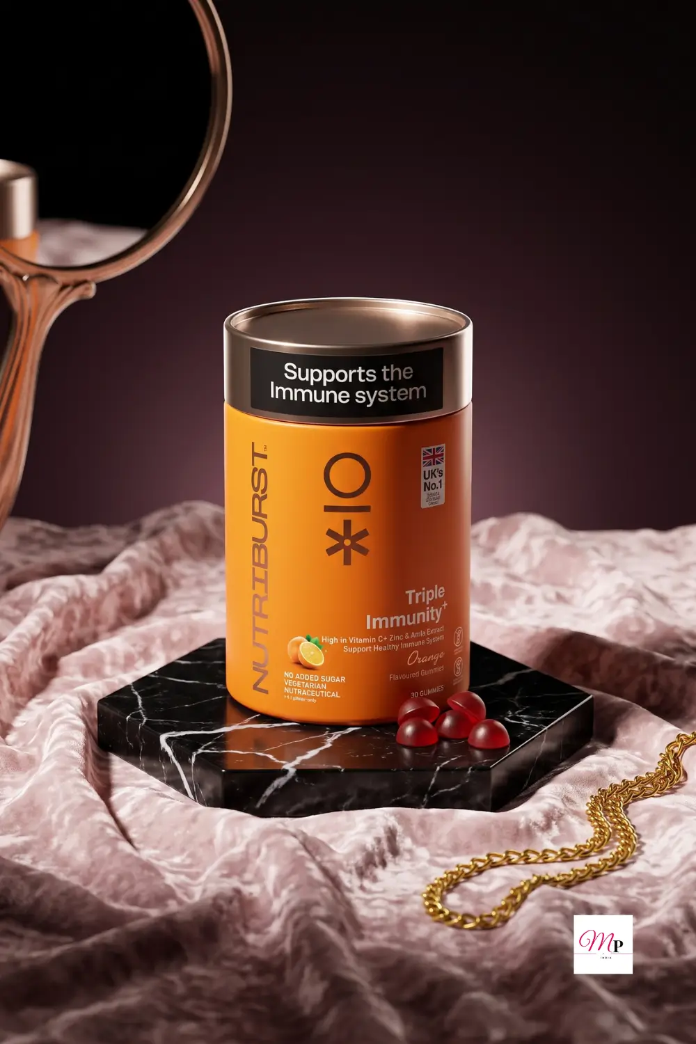 Nutriburst Triple Immunity vitamin C zinc and amla extract gummies in orange canister with red gummy candies on black marble slab