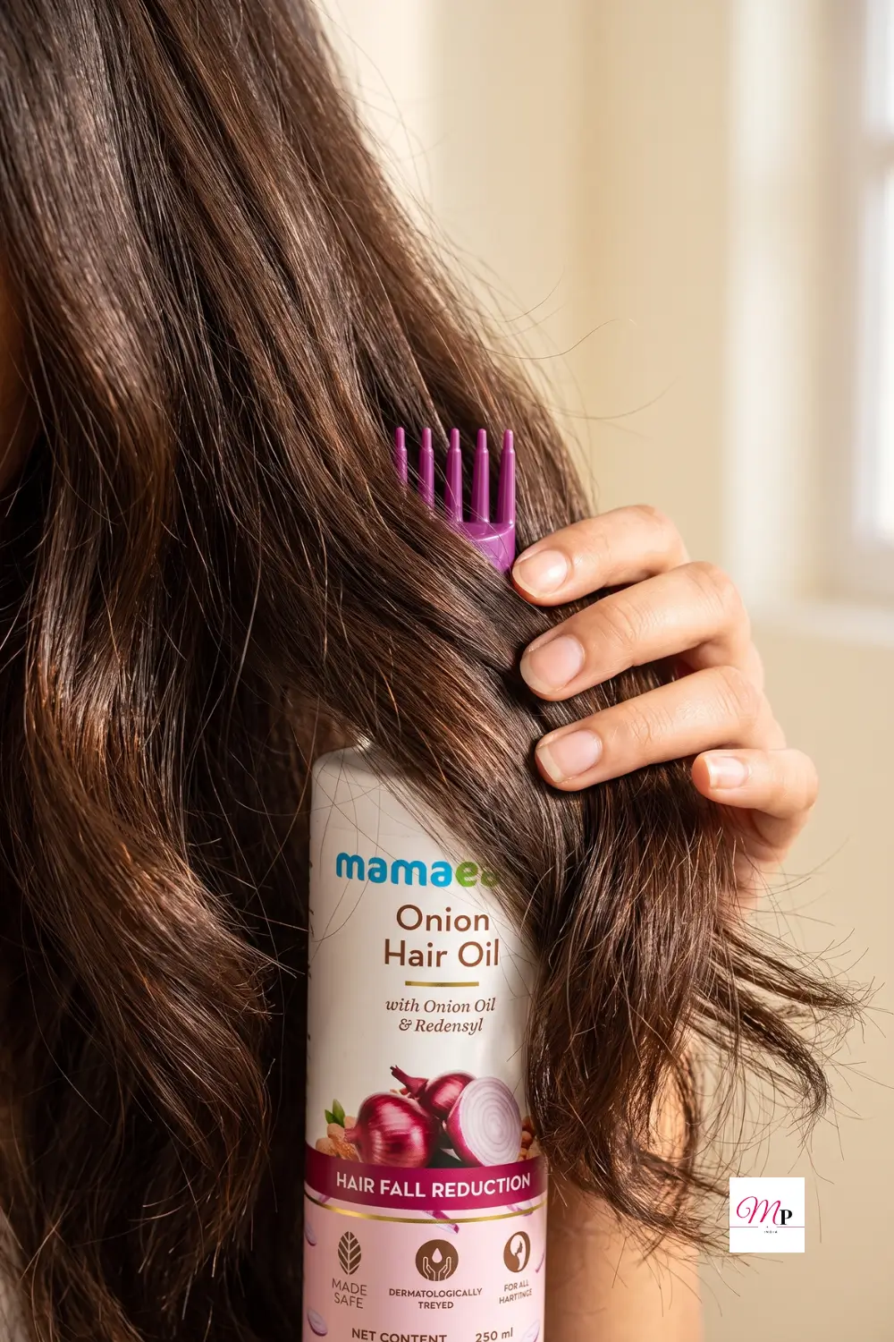 Mamaearth Onion Hair Oil comb applicator applying oil to scalp and hair roots