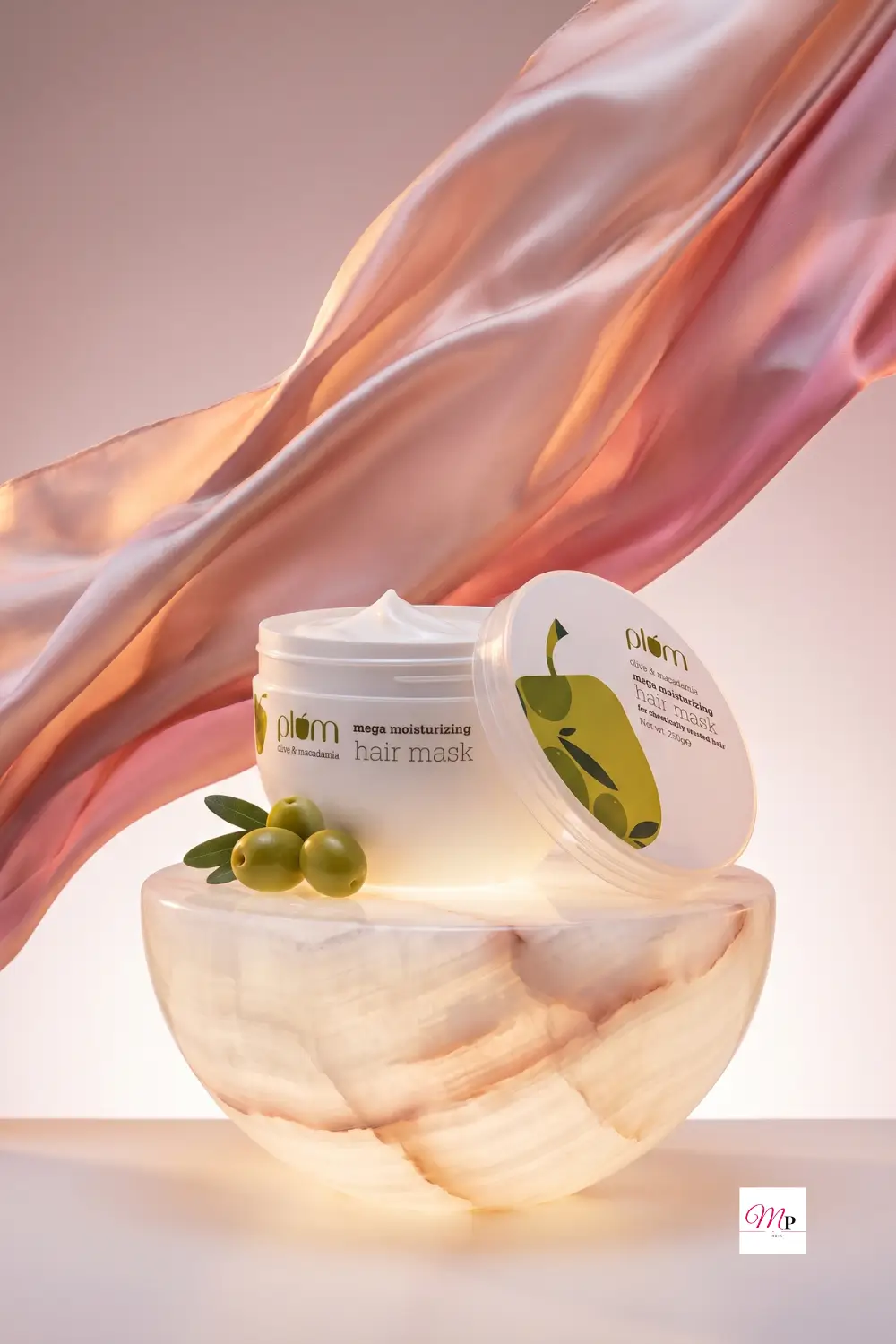 Plum Olive Macadamia hair mask on glowing onyx bowl with flowing silk fabric and olives — natural hair mask for damaged hair India