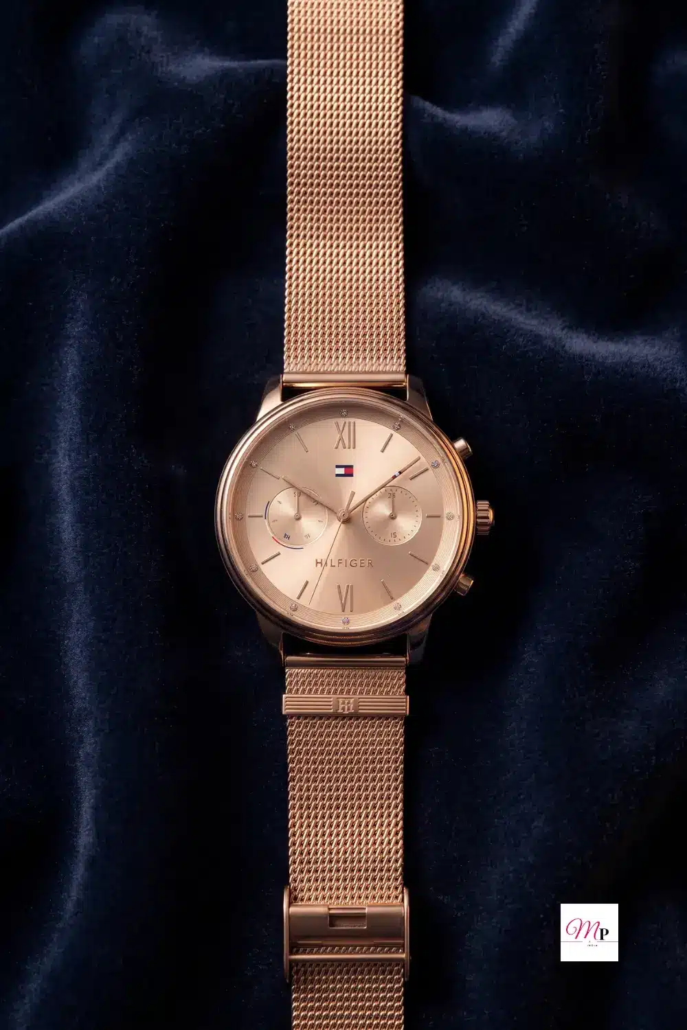 Tommy Hilfiger rose gold chronograph dial with Roman numerals and diamond indices on stainless steel mesh strap