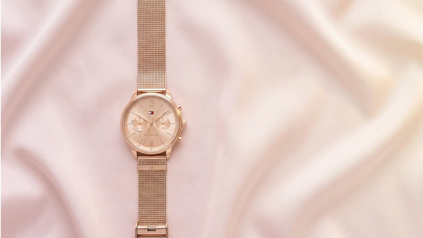 Tommy Hilfiger gold watch women myntra — rose gold chronograph timepiece with stainless steel mesh strap on blush silk fabric