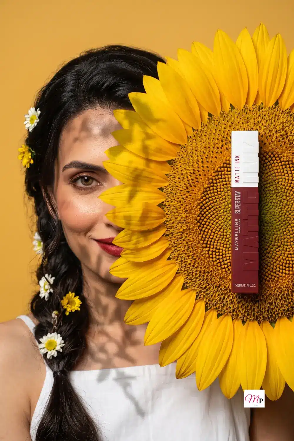 Editorial sunflower composition with Maybelline SuperStay Matte Ink lipstick for festive season makeup inspiration — Ganesh Chaturthi beauty edit for women India