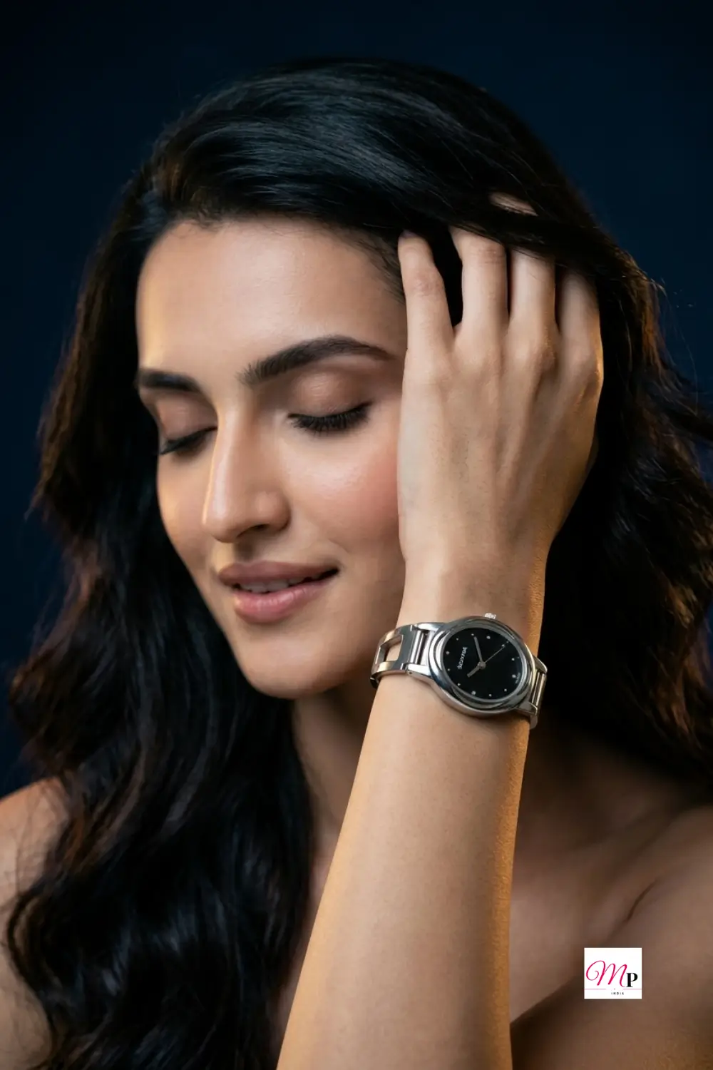 Woman in moody dark portrait wearing a Sonata analog black dial watch with silver bracelet