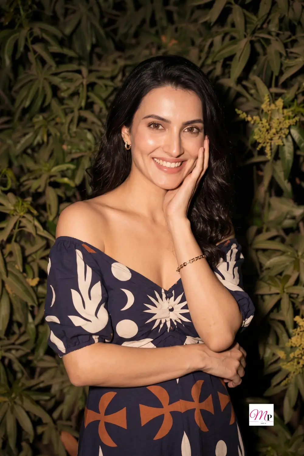 DressBerry printed crepe midi dress off-shoulder neckline close-up with sun and moon print and gold hoops